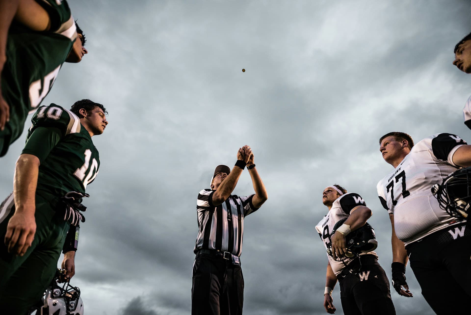 Referee conducting the opening coin toss